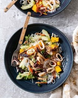 Grilled squid noodle salad with mango, cabbage, and cucumber
