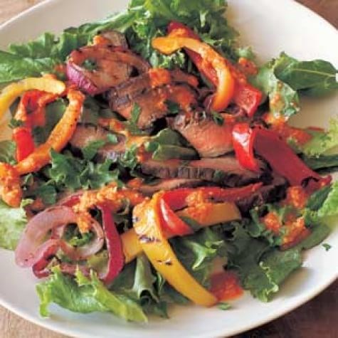 Grilled steak, pepper & onion salad with romesco dressing 