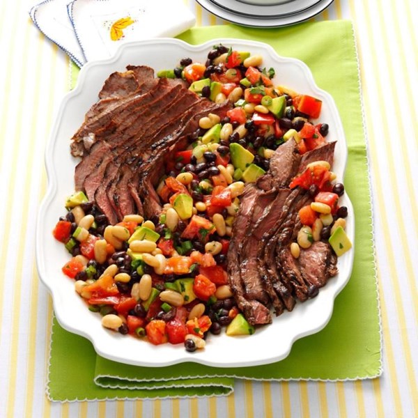 Grilled steak salad with tomatoes and avocado