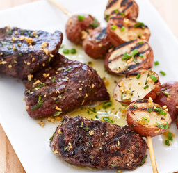 Grilled steak tips with red potato skewers
