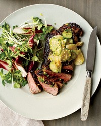 Grilled steak with cucumber and daikon salad