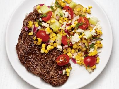 Grilled steak with Greek corn salad