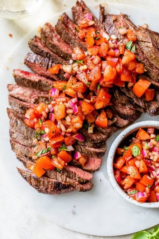 Grilled steak with tomatoes, red onion and balsamic