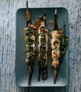 Grilled sticky-rice-stuffed garfish wrapped in bamboo leaves with chilli vinaigrette