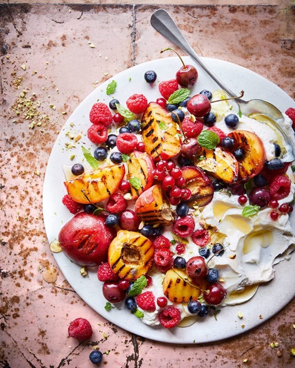 Grilled stone fruit salad with honey labneh and sweet pistachio dukkah