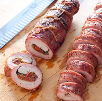 Grilled stuffed pork tenderloin with spiced sweet potato wedges