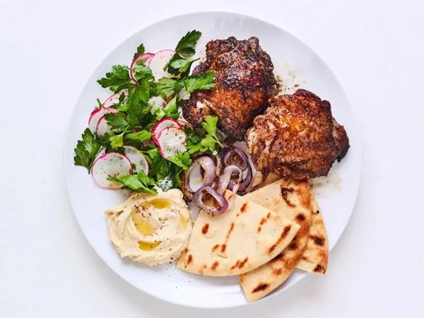 Grilled sumac chicken thighs with parsley salad
