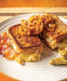Grilled Swiss cheese and bacon sandwich with beer-glazed onions