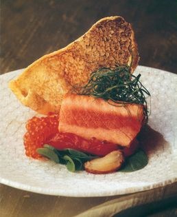 Grilled Tasmanian ocean trout with roasted chilli, shallot and mint salad, ocean trout roe and fish crackling