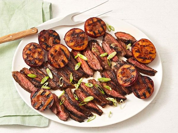 Grilled teriyaki steak with plums