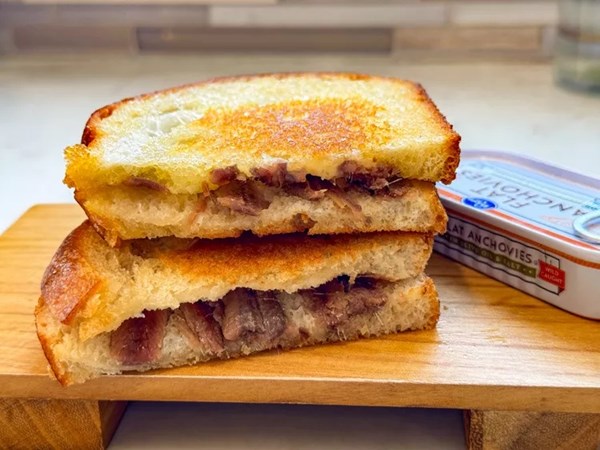 Grilled toast with butter and anchovies