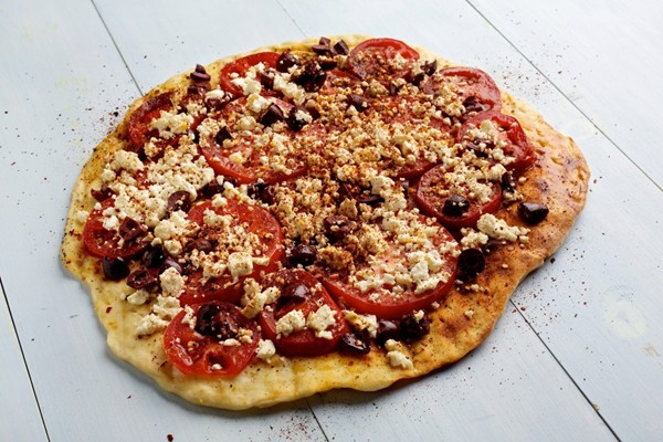 Grilled tomato, feta and olive pizza