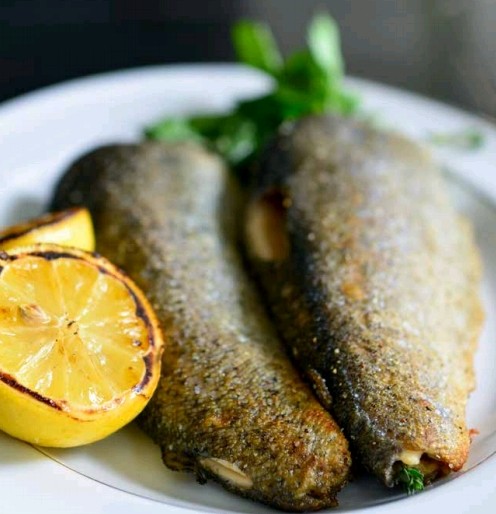 Grilled trout with tarragon, thyme, and lemon