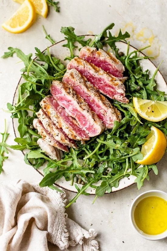 Grilled tuna over arugula with lemon vinaigrette