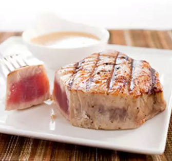 Grilled tuna steaks with red wine vinegar and mustard vinaigrette