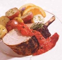 Grilled Tuscan pork rib roast with rosemary coating and red pepper relish