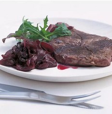 Grilled venison steaks with red onion, grape and raisin confit