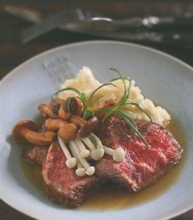 Grilled wagyu beef on horseradish creamed potatoes with soy buttered shimeji and pickled enoki mushrooms