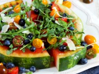 Grilled watermelon pizza with blueberries, Parmesan and arugula