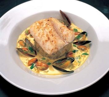 Grilled West Coast cod and skirlie mash in saffron broth with mussels, leek and fennel
