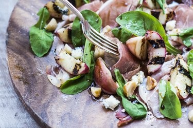 Grilled white peach & prosciutto with blue cheese, rocket & macadamia nuts
