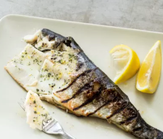 Grilled whole trout with marjoram and lemon