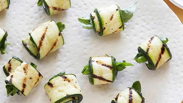 Grilled zucchini roll-ups with herbs and cheese