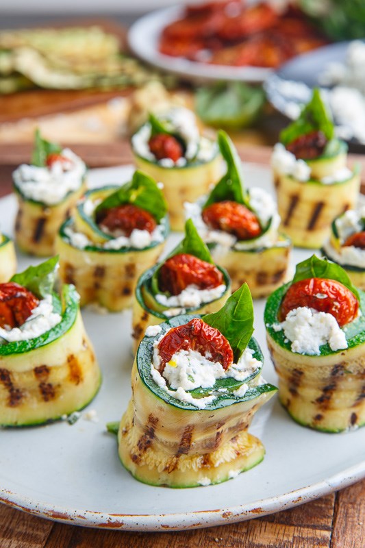 Grilled zucchini rollups stuffed with lemon-basil ricotta and slow roasted tomatoes