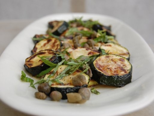 Grilled zucchini with capers, basil and lemon