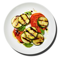 Grilled zucchini with fresh tomatoes and mozzarella