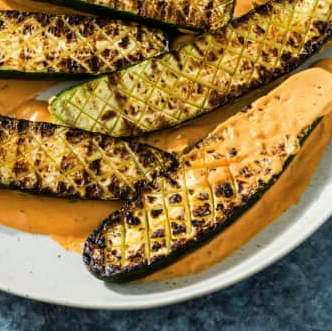 Grilled zucchini with red pepper sauce