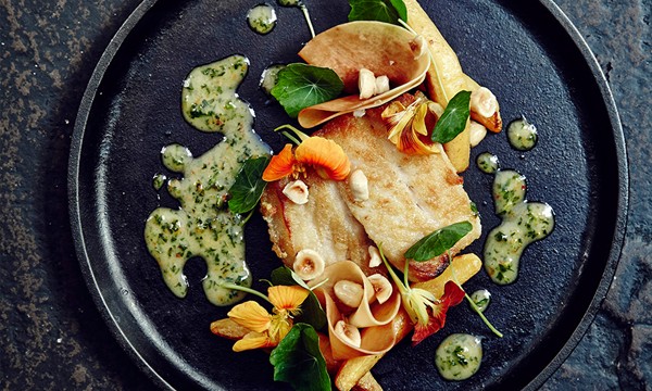 Grouper with pan-roasted and pickled butternut squash, nasturtium jus, and hazelnuts