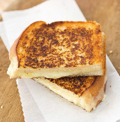 Grown-up grilled cheese sandwiches with cheddar and shallot