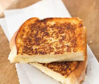 Grown-up grilled cheese sandwiches with cheddar and shallots