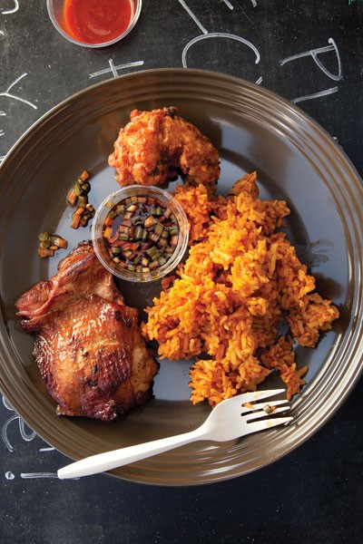 Guam-style chicken with red rice (Tininon mannok yan hineska' agaga)
