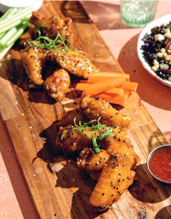 Guilty pleasure wings with rooster sauce and sweet chili soy sauce