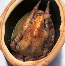 Guinea fowl baked with thirty cloves of garlic