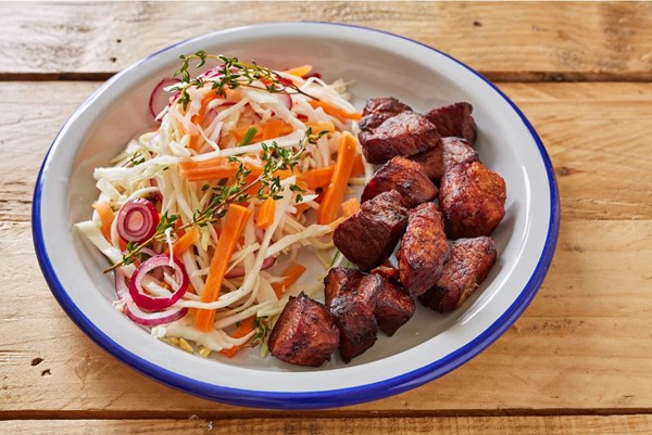 Haitian griot with pikliz [Keshia Sakarah]