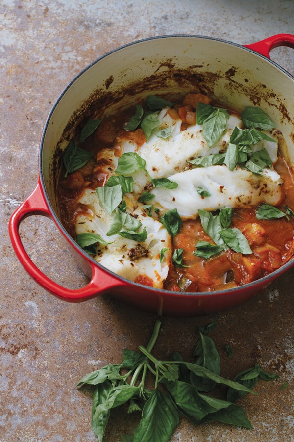 Hake poached in spicy tomato-eggplant sauce