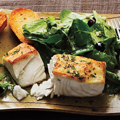 Halibut à la Provencal over mixed greens