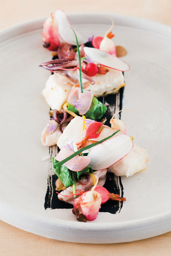 Halibut with braised & raw radishes, sunflower seeds, calamari & citrus