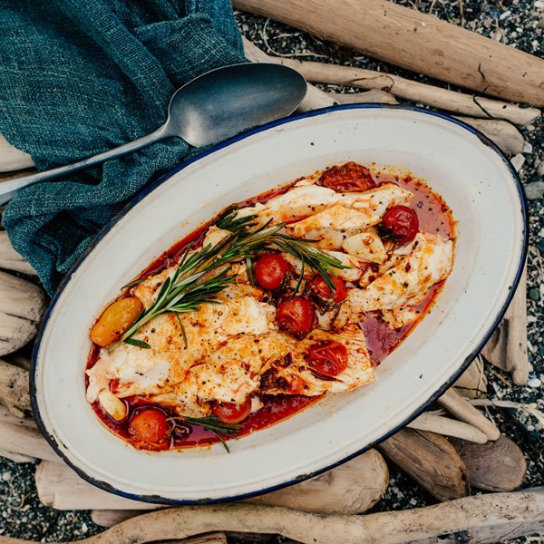 Halibut with spicy sausage, tomatoes, and rosemary
