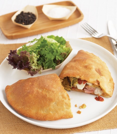 Ham and grilled artichoke calzone
