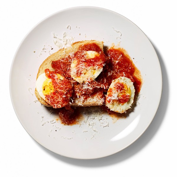 Hard-boiled eggs simmered in classic tomato sauce