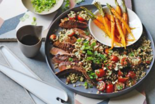 Harissa beef and carrot with barley and tomato salad