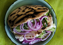Harissa flatbread, creamed feta and onion