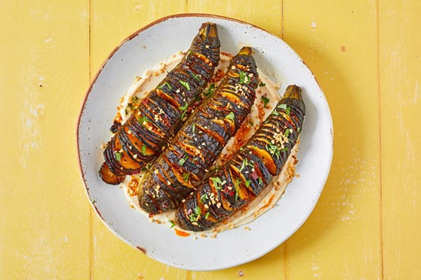  Harissa Hasselback courgettes with butter bean and tahini dip and dukkah