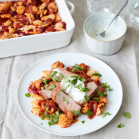 Harissa lamb, cauliflower and butter bean traybake