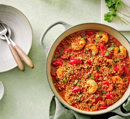 Harissa, pepper and prawn stew with giant couscous