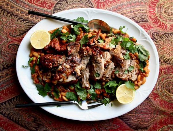 Harissa-rubbed pork shoulder with white beans and chard